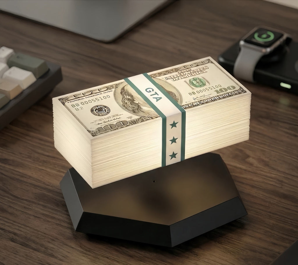 Solis Hoverstack — floating cash stack lamp hovering over its hexagon base on a desk
