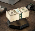 Solis Hoverstack — floating cash stack lamp hovering over its hexagon base on a desk