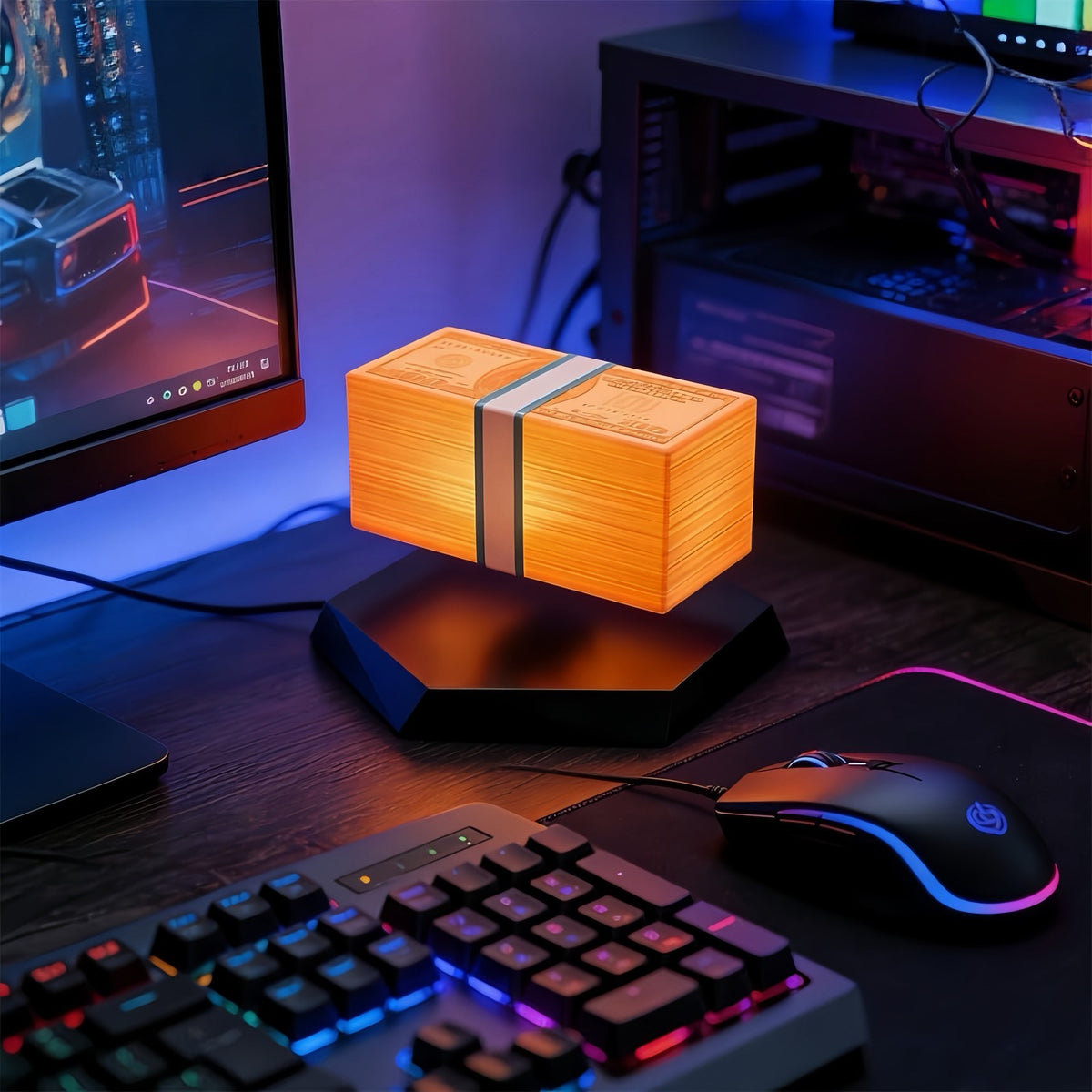 Solis Hoverstack — levitating money lamp glowing orange on a gaming desk