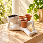 Solis Lazy Bloom — reclining ceramic head planter with a mini pot on a sunny windowsill