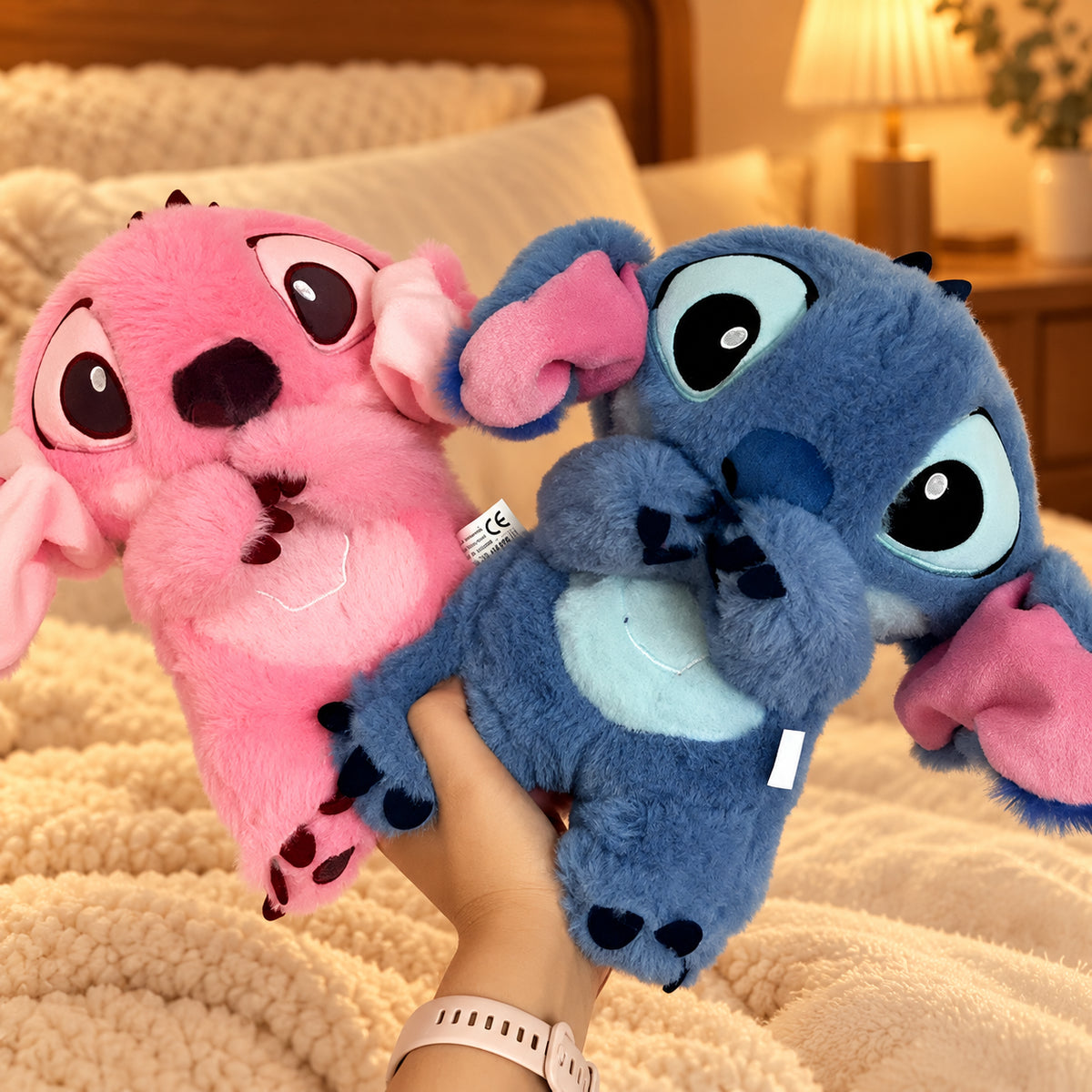 Solis Lullo — pink and blue breathing Stitch plush toys together