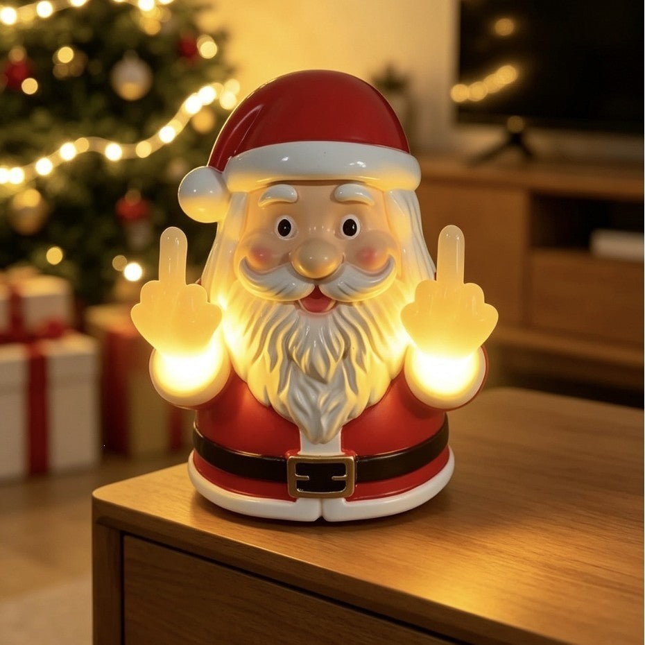 Solis Naughty Glow — middle finger Santa light glowing next to a Christmas tree