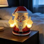 Solis Naughty Glow — naughty Santa night light glowing on a bedside table