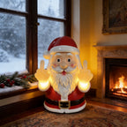 Solis Naughty Glow — middle finger Santa light by a snowy window and a fireplace
