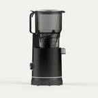 Solis Nectar 65 in midnight black, side view showing the hopper handle and juice spout