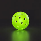 Green glowing pickleball