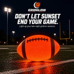 Light-up football glowing orange on a field at night