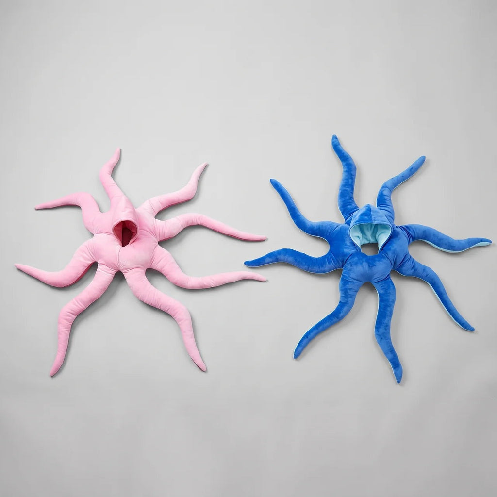 Solis Octo Costume — Pink: plush octopus costume laid flat beside the blue one