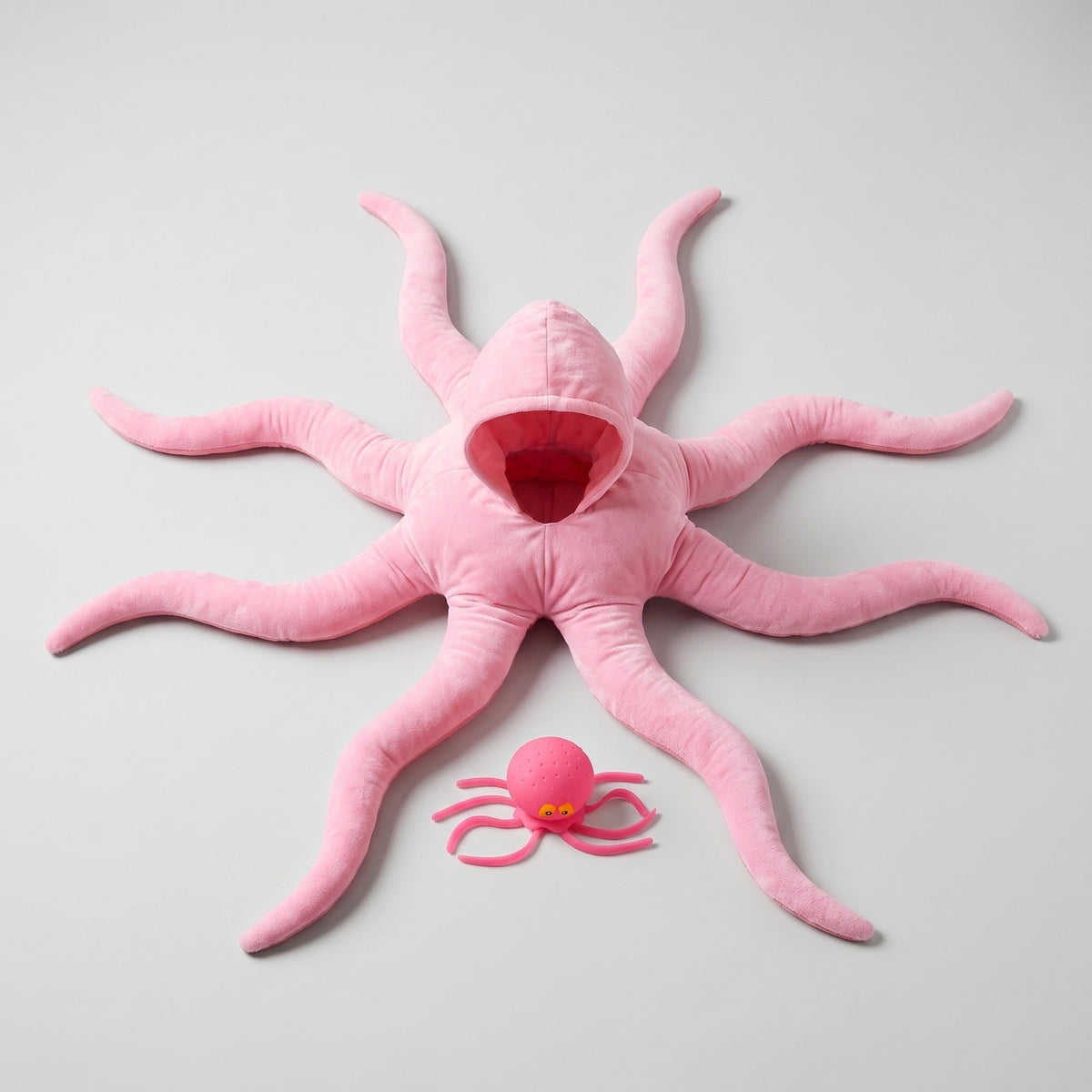 The pink Solis Octo Costume from above, arms spread