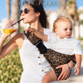 Solis Perch — parent carrying a toddler on the hip in the leopard sling
