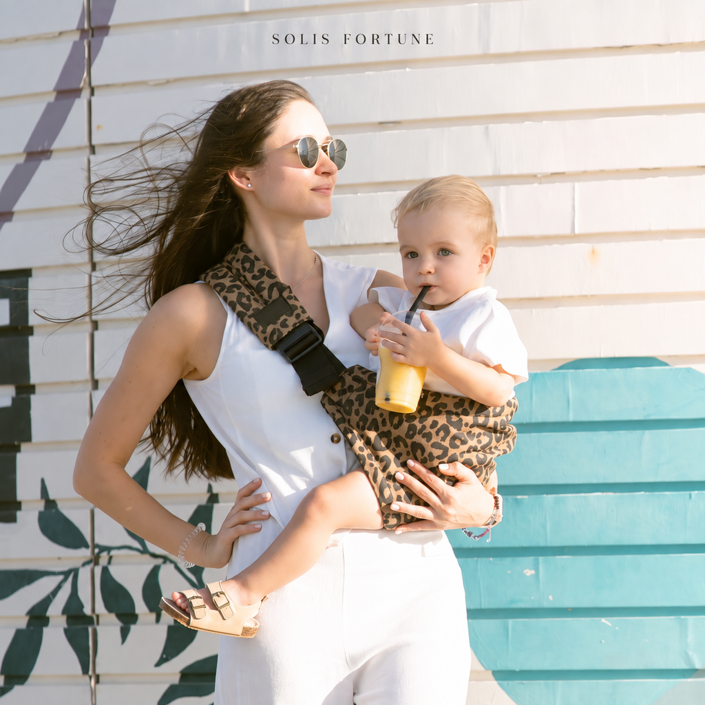 Solis Perch — toddler sitting securely on the hip seat