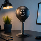 Solis Popjab — desk punching ball on a dark desk under a lamp