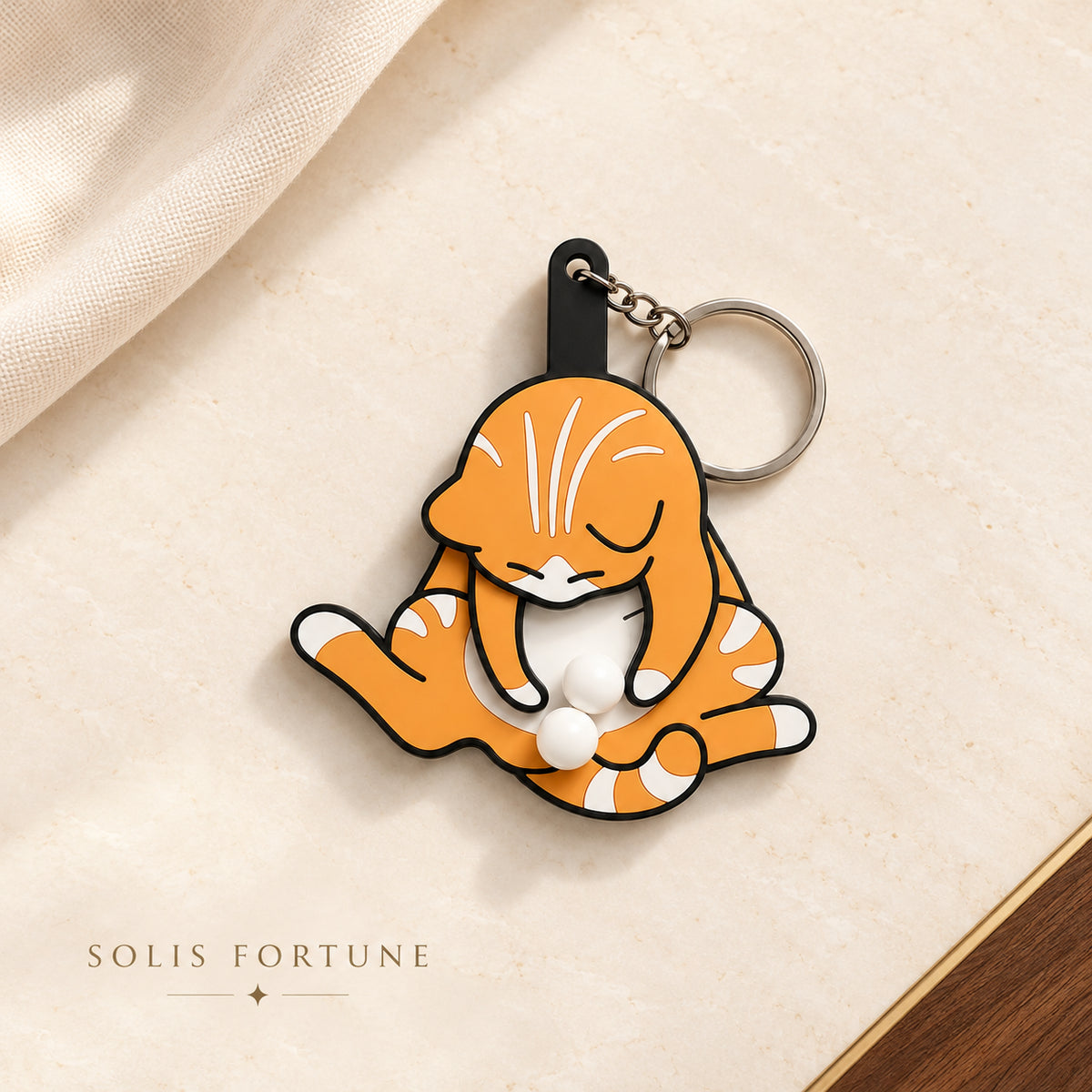 Solis Purrpop — Orange: squishy cat keychain with pop-out balls, ginger tabby