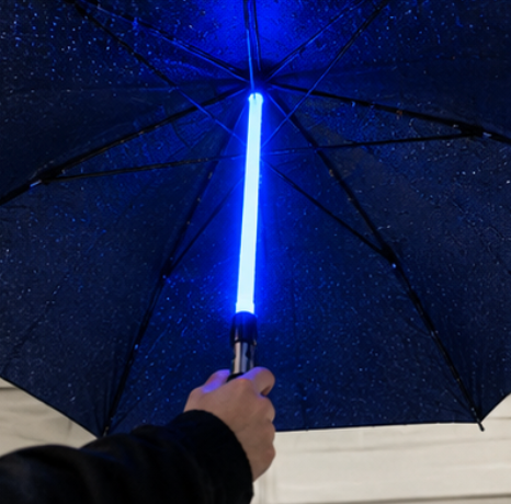 Lightsaber umbrella — Glowing blue LED lightsaber shaft seen from under the canopy, Solis Saber