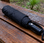 Lightsaber umbrella — Star Wars umbrella folded on a wooden bench, Solis Saber