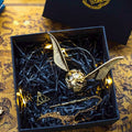 Solis Seeker — Golden Snitch ring box with gold wings in its gift box with wand key and chain