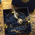 Solis Seeker — Golden Snitch ring box with gold wings in its gift box with wand key and chain