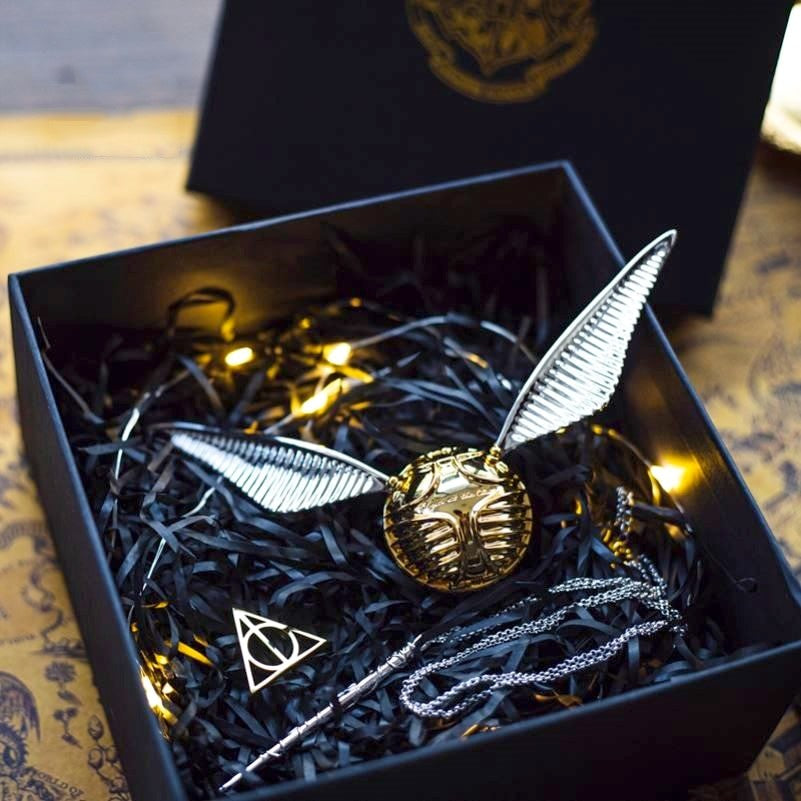 Solis Seeker — Golden Snitch ring box with silver wings in its gift box