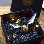 Solis Seeker — Golden Snitch ring box with silver wings in its gift box