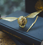 Solis Seeker — winged snitch ring box on its triangle stand with the wand key