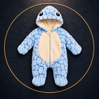 Solis Shell turtle onesie in blue — product front view on dark textile