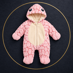 Solis Shell turtle onesie in pink — product front view on dark textile