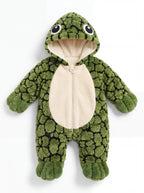 Solis Shell turtle onesie in green, front view: plush shell-pattern body, cream front panel, hood with turtle eyes