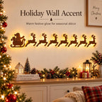 Solis Sleighline — wooden Santa sleigh and 7 reindeer glowing on a living room wall above a sideboard
