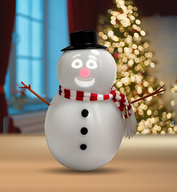 Solis Snow Chatter — talking animated snowman with a glowing projected face in front of a Christmas tree