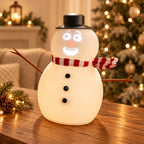 Solis Snow Chatter — singing snowman decoration on a red table with a smiling animated face