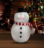 Solis Snow Chatter — talking snowman decoration by the fireplace and Christmas tree