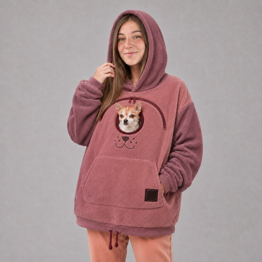 Solis Snuggle Pet Pouch Hoodie in rose pink with a small dog in the pouch