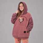 Solis Snuggle Pet Pouch Hoodie in rose pink with a small dog in the pouch