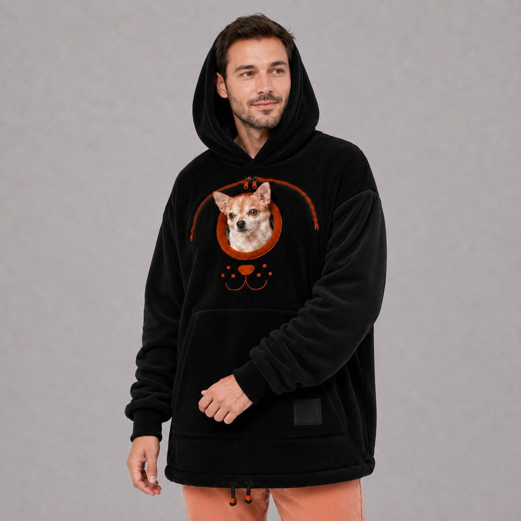Solis Snuggle Pet Pouch Hoodie in black worn by a man carrying a small dog