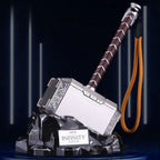 Solis Storm Hammer resting in its rock-effect charging cradle, with the wrist lanyard