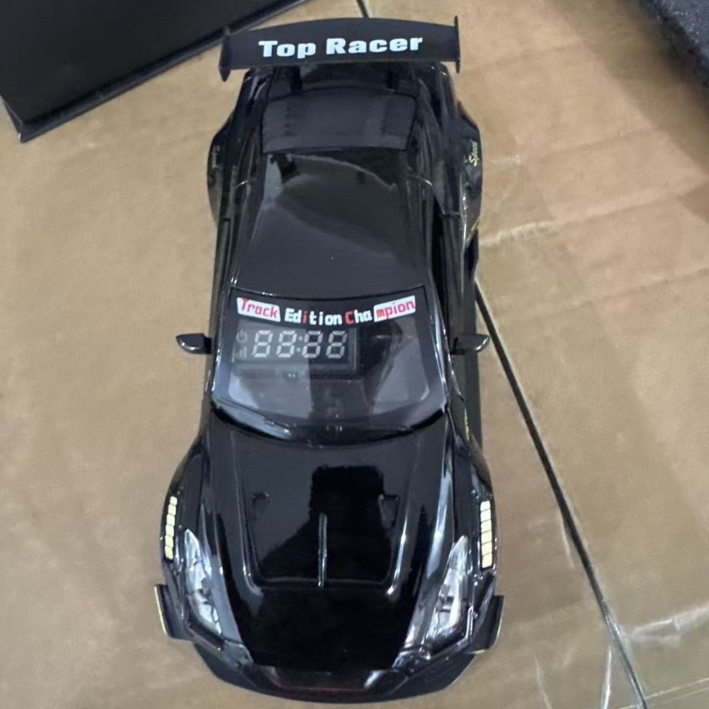 Solis Redline — Nissan GT-R, Black: black Nissan GT-R race car alarm clock, top view