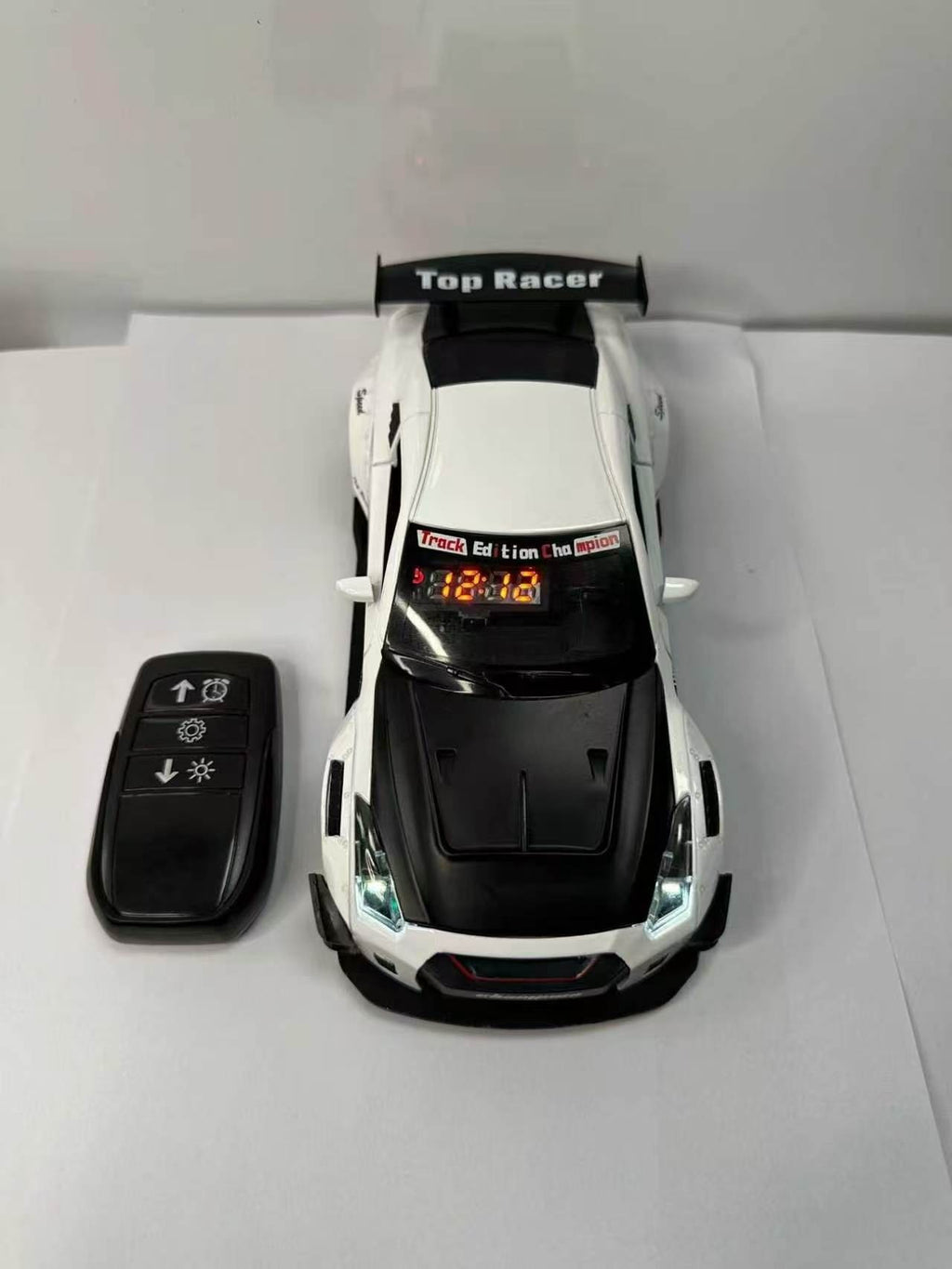 Solis Redline — white GT-R alarm clock and key-fob remote, top view