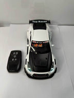 Solis Redline — white GT-R alarm clock and key-fob remote, top view