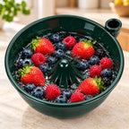 Solis Swirl — green ceramic berry bowl full of strawberries and blueberries with water swirling