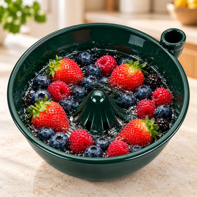 Solis Swirl — green ceramic berry bowl full of strawberries and blueberries with water swirling