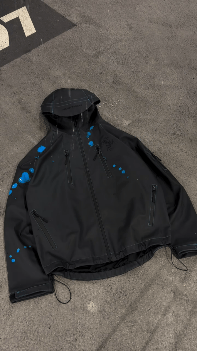 Solis Tidemark Water-Reactive Rain Jacket changing colour as water hits it