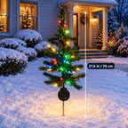 Solis Twinkle Trees — solar Christmas tree light, about 70 cm tall, on a snowy lawn