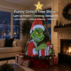 Solis Yuletide — a cheeky green character design lit across the tree