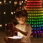 Solis Yuletide — a child opening a present under the glowing tree